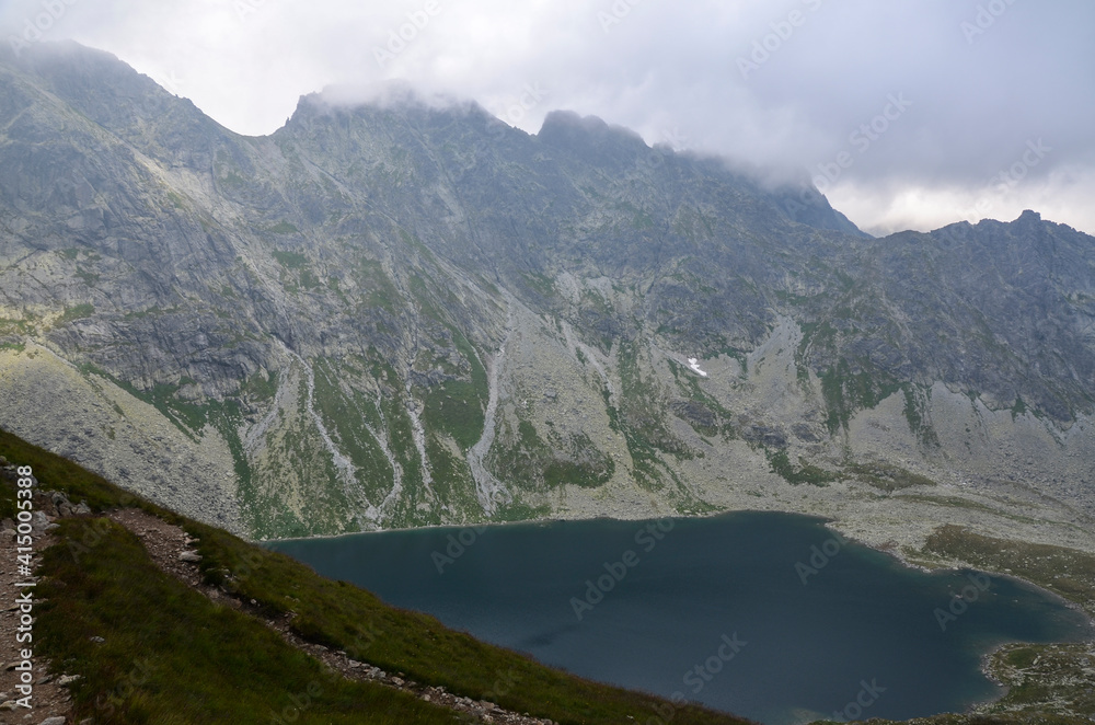 Mountain lake Velke Hincovo pleso under peak Mengusovsky stit in Mengusovska valley in the national park of High Tatras - Slovakia