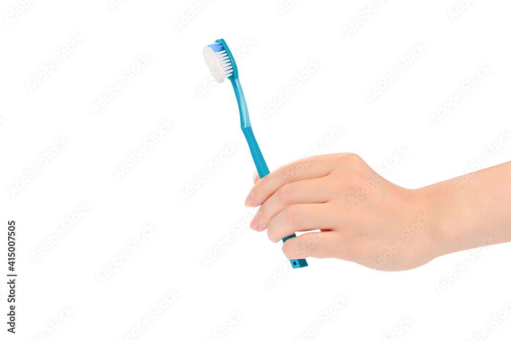 Woman holds toothbrush with toothpaste in her hand isolated on white background. Woman holds toothbrush with toothpaste in her hand isolated on white background.
