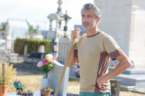 portrait of a groundskeeper in cemetery photo