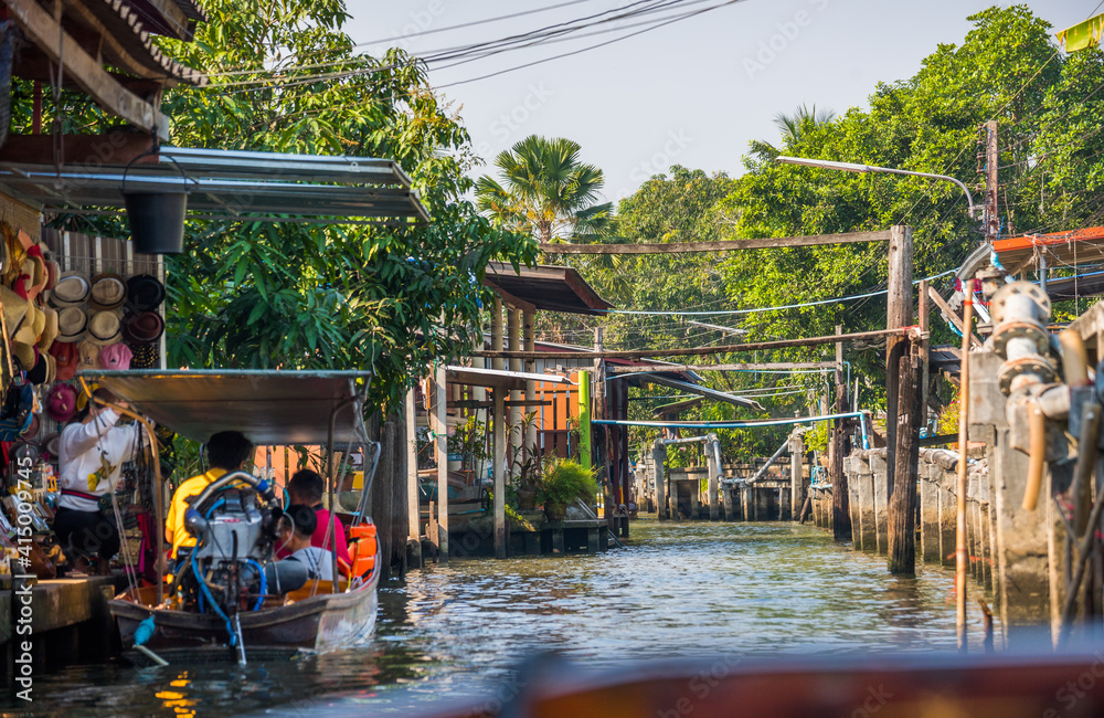 Famous Floating Market in Thailand, Damnoen Saduak Floating Market, Tourists Visiting by Boat, Ratchaburi, Thailand.