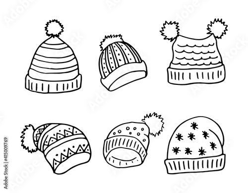 A set of warm winter hats with pom-poms. Doodle style. Hand drawn vector illustration on white background in black outline. Cozy winter warm clothes.