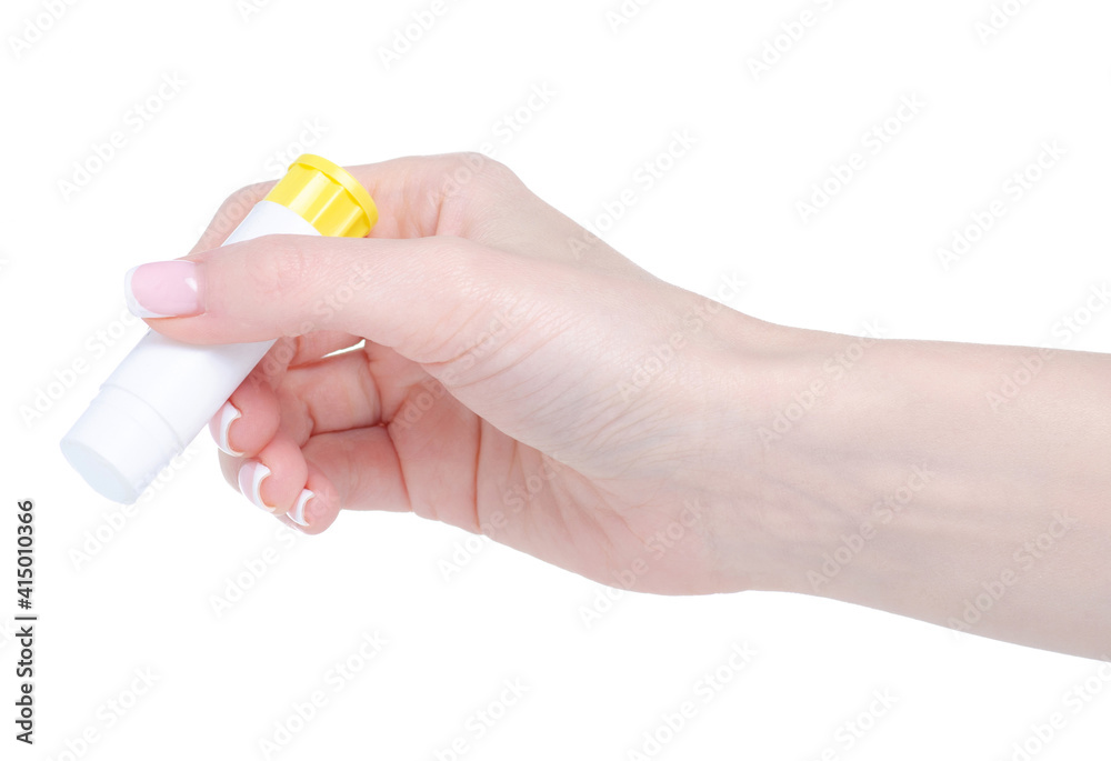 Glue stick in hand on white background isolation Glue stick in hand on white background isolation