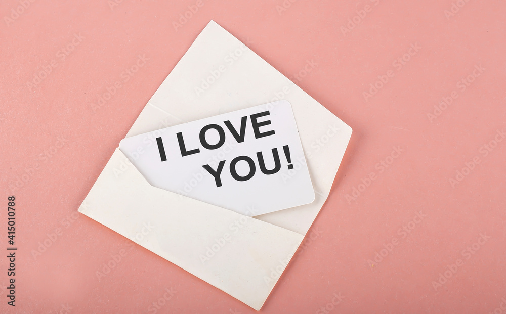 Word Writing Text I LOVE YOU on card on the pink background Word Writing Text I LOVE YOU on card on the pink background