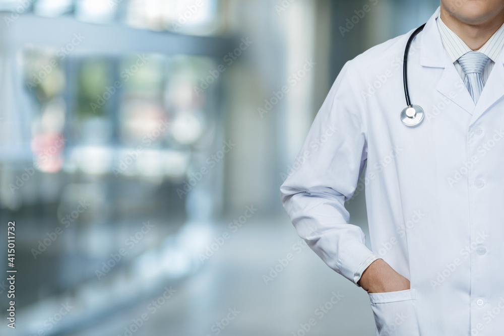 The doctor stands on a blurred background. The doctor stands on a blurred background.