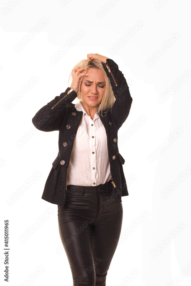 Upset girl feels pain while standing in studio. Upset girl feels pain while standing in studio.