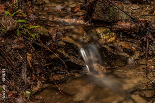 Small creek near Malse river with Doudlebsky waterfall in cold winter color day photo