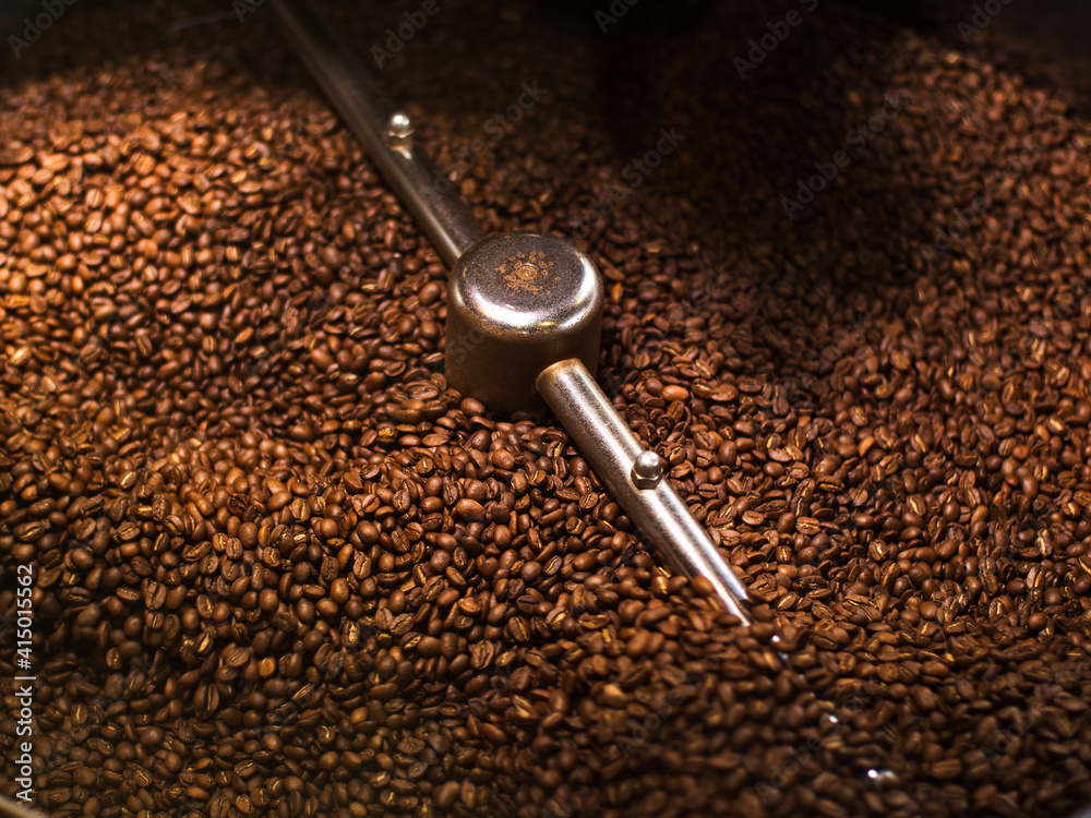 Coffee Roaster With Roasted Coffee Beans Close-up