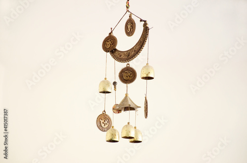Photography Isolated shot of hanging decorative wind chime with bells on white background