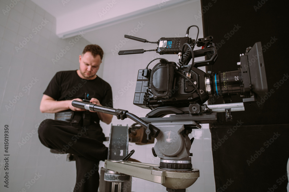 Director of photography with a camera in his hands on the set. Director of photography with a camera in his hands on the set.