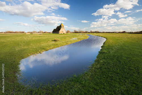 St. Thomas a Becket Church on Romney Marsh in afternoon sunlight, Fairfield, Kent photo