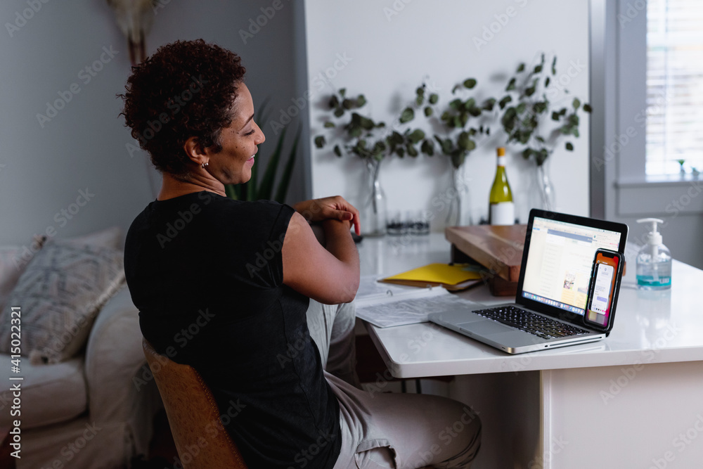 Creative woman works from home remotely using laptop Creative woman works from home remotely using laptop