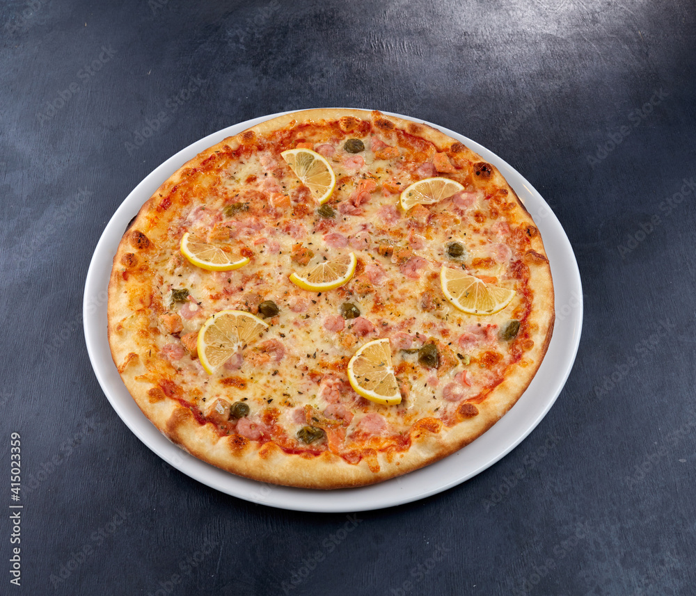 fresh pizza on the white plate fresh pizza on the white plate