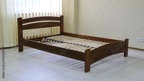 arched wooden bed with slats photo