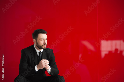  bearded businessman,  red background