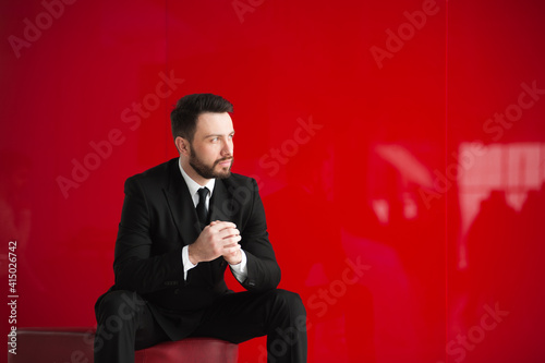  bearded businessman,  red background