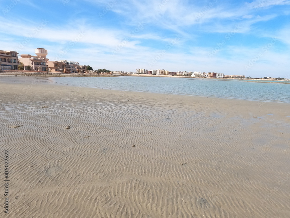 waves on the sand beach, blue water of the Red Sea, Hurgarda, Egypt waves on the sand beach, blue water of the Red Sea, Hurgarda, Egypt