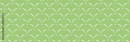 Zielone tło z białymi zajączkami na wielkanoc 