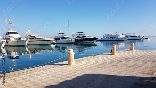 ships in port, catamarans for tourist tours, snorkeling, diving, port of Hurghada, Egypt