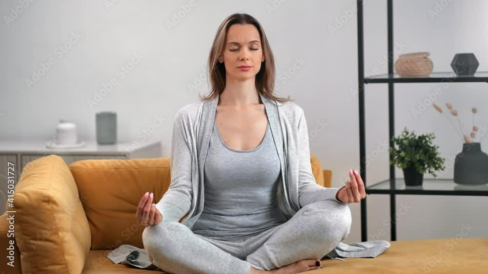 Relaxed female in lotus position enjoying meditation harmony balance. Shot with RED camera in 4K Relaxed female in lotus position enjoying meditation harmony balance. Shot with RED camera in 4K