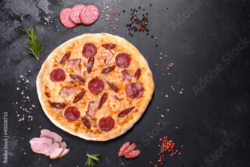 Fresh delicious pizza made in a hearth oven with four types of meat and sausage