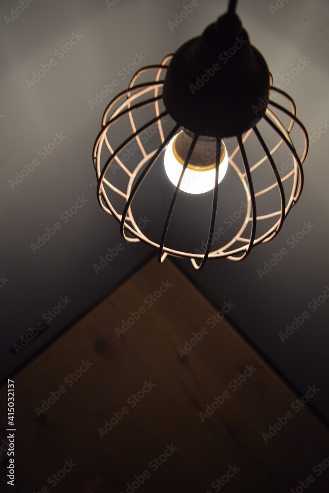 Naklejka premium Lamp in metal wire frame, cage, industrial design, Mannheim, Germany