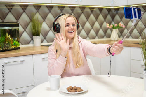 Girl blogger with blonde hair to chat on phone