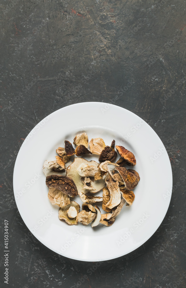 Dried porcini mushrooms on a decorative background Dried porcini mushrooms on a decorative background