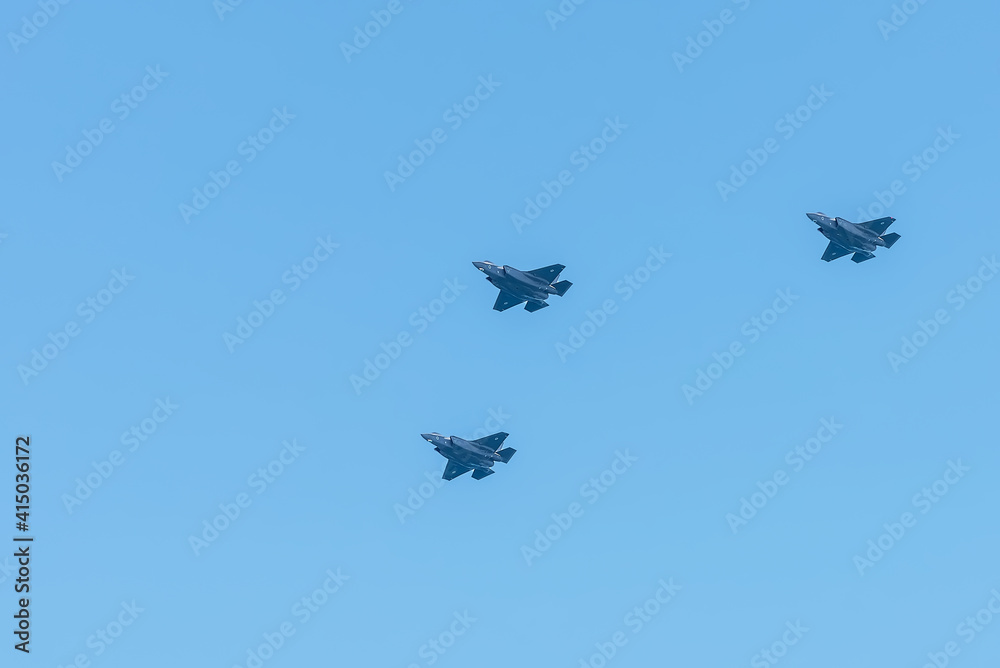 Three military aircraft in the blue sky. Independence Day in Israel, a national holiday. Israel Air Force parade Three military aircraft in the blue sky. Independence Day in Israel, a national holiday. Israel Air Force parade