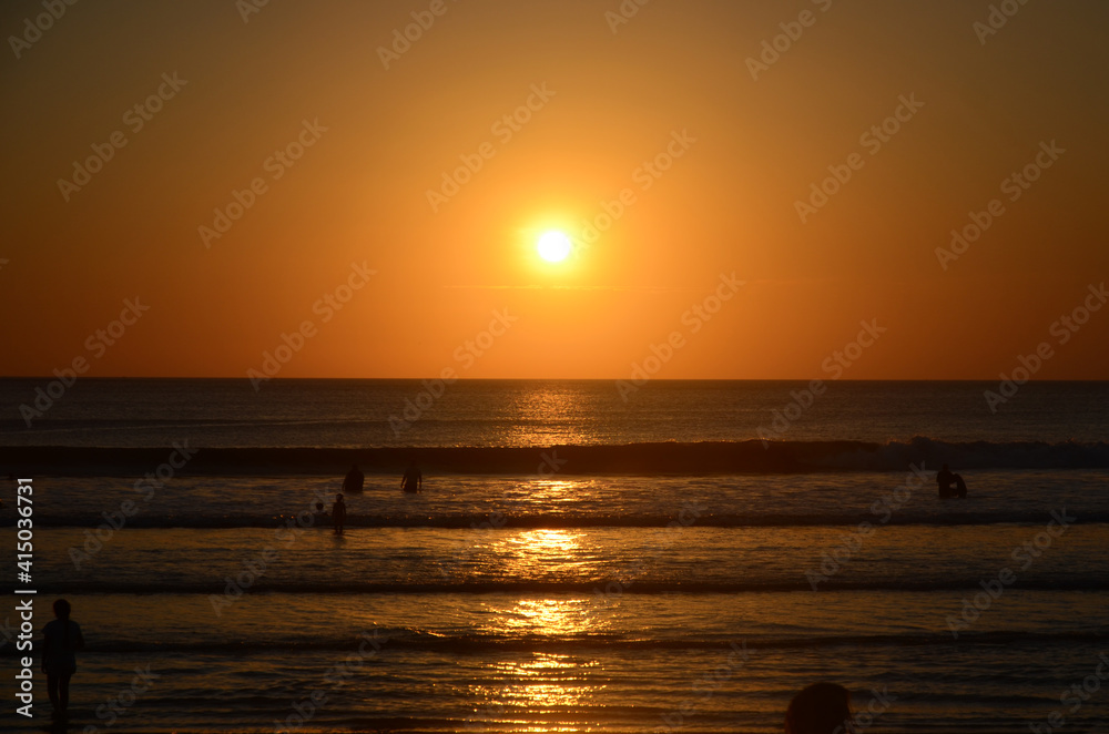 Silhouettes of people at the sunset of Beach, Bali