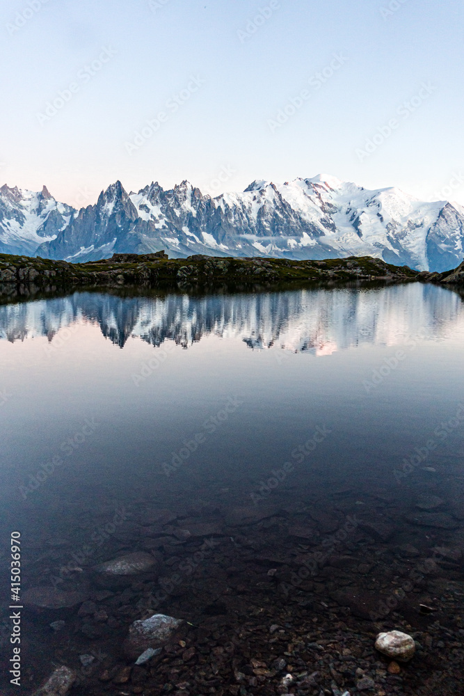 Lac Blanc: one of the most famous and beautiful alpine lakes surrounded by the mont blanc alps, near the village of Chamonix - Mont blanc, France - August 2020.