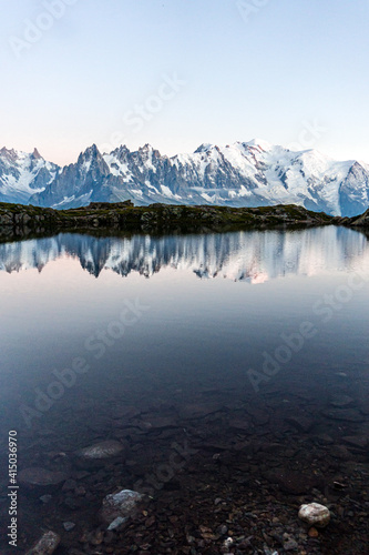 Lac Blanc: one of the most famous and beautiful alpine lakes surrounded by the mont blanc alps, near the village of Chamonix - Mont blanc, France - August 2020.