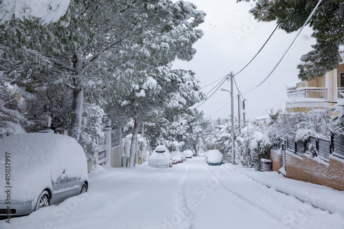 Fototapeta Naklejka Na Ścianę i Meble -  Beautiful winter morning snow covered streets of Athens, Greece, 16th of February 2021.