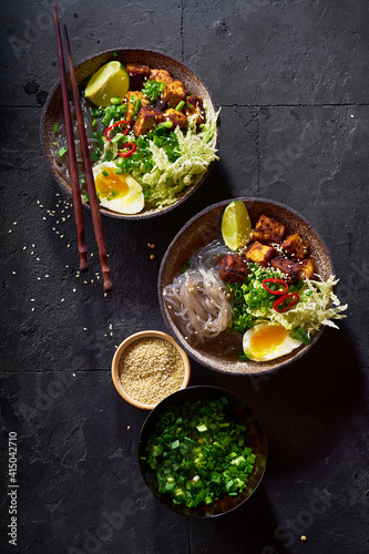 Spicy vegetarian ramen with fried tofu, chinese cabbage and sweet potato noodles