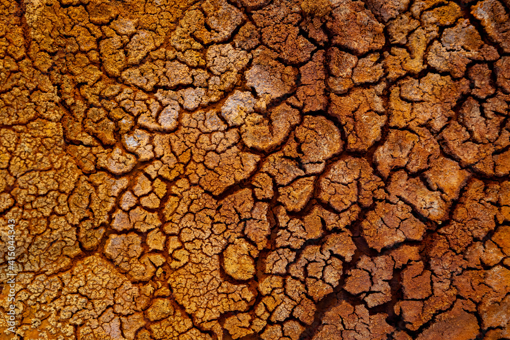 Top view of textured background of dry cracked earth in Minas de Rio tinto Top view of textured background of dry cracked earth in Minas de Rio tinto