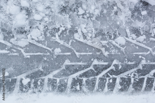 Trace of car tire in the snow Close up