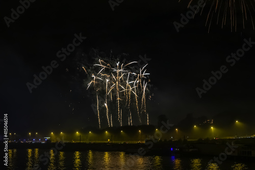 Colored firework lights in the night sky on the river Seine in Paris. France. photo