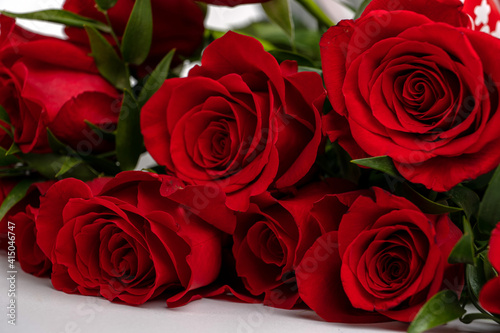 bouquet of red roses on a white table