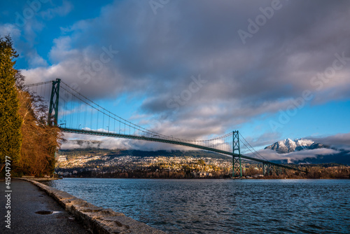 lions gate bridge in the morning with cloudy sky backgrounds