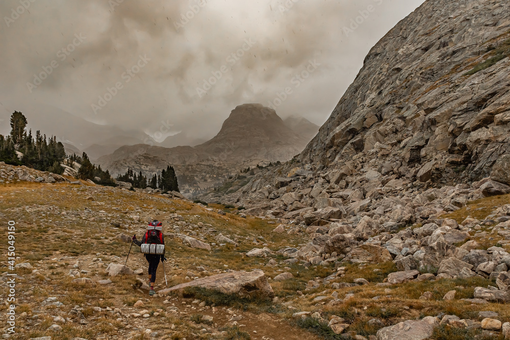 A Woman Is Backpacking and Is Surprised by a Summer Snow Storm, Wind River Range, Wyoming