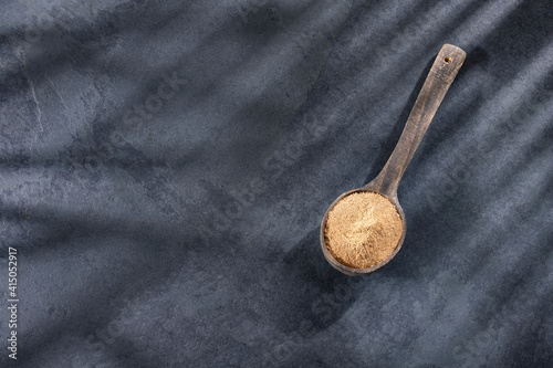 Lepidium meyenii - Organic maca dry powder in wooden spoon