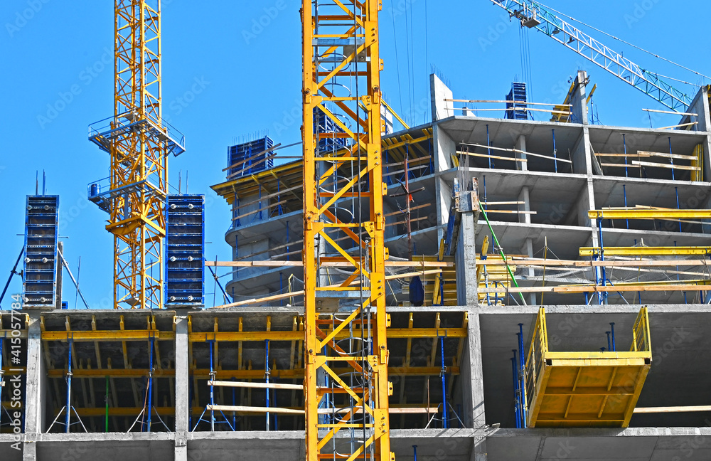 Crane and highrise construction site Crane and highrise construction site