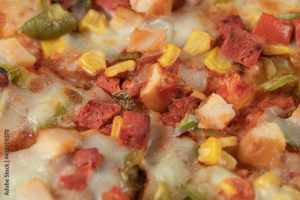 Pizza with chopped pepperoni and mixed ingredients Pizza with chopped pepperoni and mixed ingredients