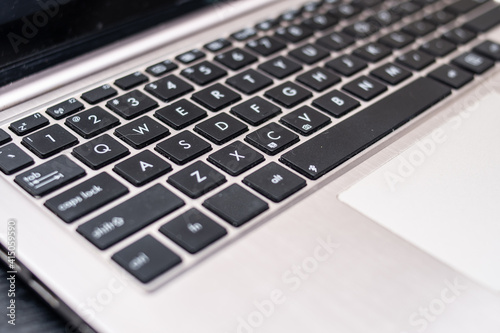 partial view of a laptop keyboard and touchpad