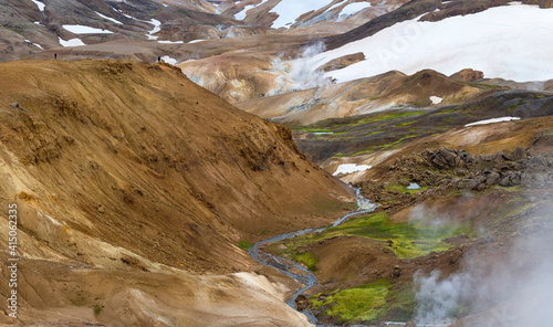 Hikers in the geothermal area of Hveradalir in the mountains of Kerlingarfjoll in the highlands of Iceland. photo