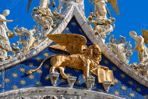 Lion of Saint Mark on the facade of St Mark's Basilica in Venice, Italy