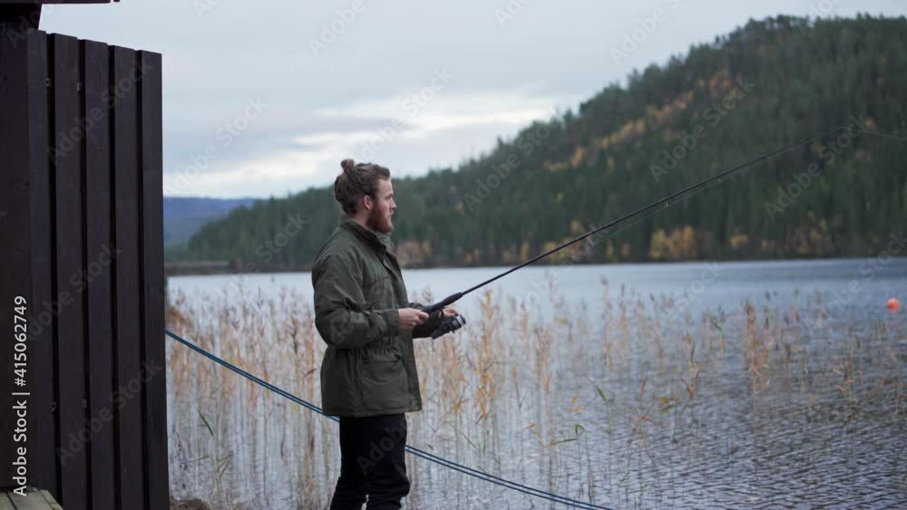 Fishing - Man Throws And Reel Fishing Rod Into The River Of Norway. medium shot Fishing - Man Throws And Reel Fishing Rod Into The River Of Norway. medium shot