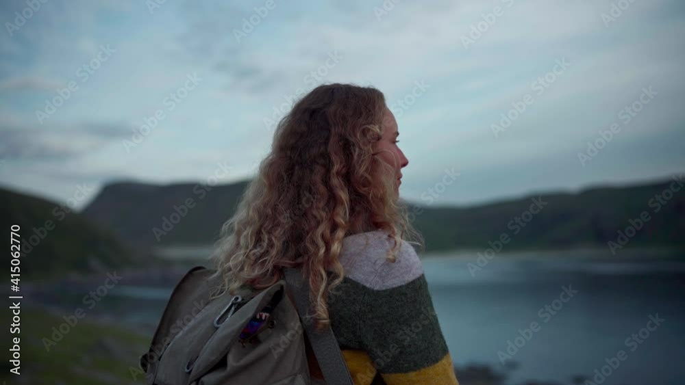 Caucasian Woman Staring At The Lake In Norway. - medium shot Caucasian Woman Staring At The Lake In Norway. - medium shot