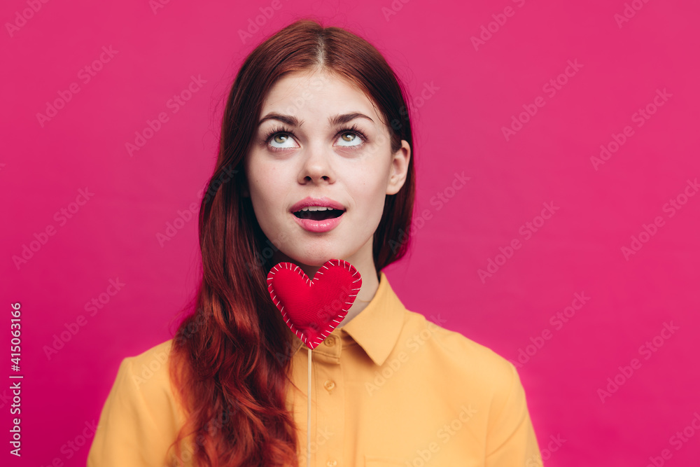 valentines day woman with heart on stick on pink background cropped view