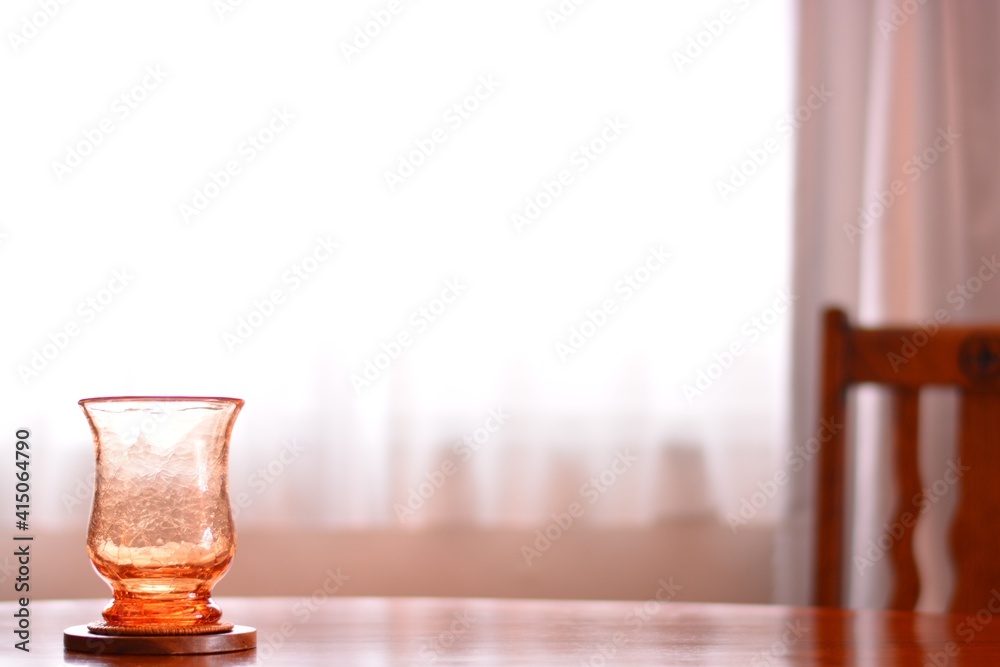 “art deco” crystal vase. put on a walnut oval dining table.
window is bright.
This expensive antique furniture is made in England.
clear background with soft focus image. “art deco” crystal vase. put on a walnut oval dining table.
window is bright.
This expensive antique furniture is made in England.
clear background with soft focus image.