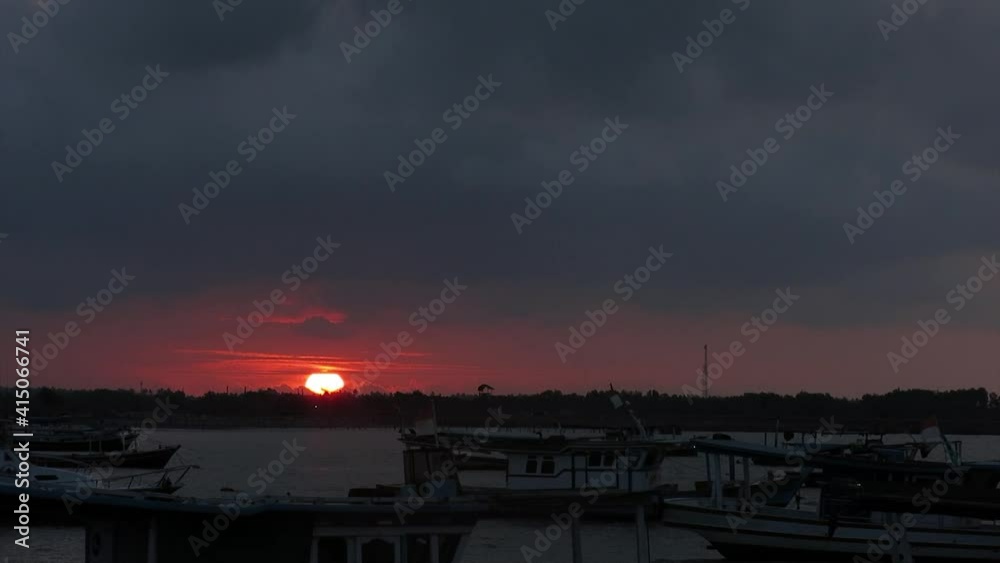sunset or sunrise against the foreground of a fishing boat. sunset or sunrise against the foreground of a fishing boat.